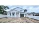 Charming two-story home with a covered front porch and an attached garage at 745 31St N Ave, St Petersburg, FL 33704