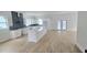 Spacious kitchen with modern white cabinets, a large island, and stainless steel appliances at 745 31St N Ave, St Petersburg, FL 33704