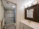Well-lit bathroom features framed mirror, sink and vanity, shower and tub combo at 7700 92Nd St # 207, Seminole, FL 33777