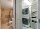Bathroom features a tiled shower, vanity and is connected to the laundry room at 7700 92Nd St # 207, Seminole, FL 33777
