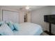 Comfortable bedroom features a ceiling fan, neutral walls, and double door closet at 7700 92Nd St # 207, Seminole, FL 33777