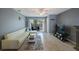 Comfortable living room with sliding doors to the outdoor patio at 7700 92Nd St # 207, Seminole, FL 33777