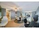 Open floorplan living space featuring a dining area, computer desk, and a seating area at 7700 92Nd St # 207, Seminole, FL 33777