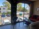 Cozy condo balcony, with comfortable seating and view of surrounding neighborhood at 7701 Starkey Rd # 602, Seminole, FL 33777