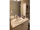Bathroom featuring a single sink vanity and a cabinet above the toilet at 7701 Starkey Rd # 602, Seminole, FL 33777