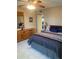 Bedroom featuring a queen bed, a dresser with a mirror, and an ensuite bathroom at 7701 Starkey Rd # 602, Seminole, FL 33777