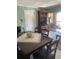 Bright dining area featuring tile floors and a pass-through to the kitchen at 7701 Starkey Rd # 602, Seminole, FL 33777