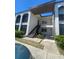 Inviting two-story condo building with well-maintained landscaping and open stairwell at 7701 Starkey Rd # 602, Seminole, FL 33777