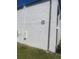 Exterior angle view showing building 21, set against a sunny, grassy landscape at 7701 Starkey Rd # 602, Seminole, FL 33777