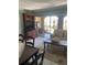 Inviting living room featuring comfortable seating, a TV, and sliding doors to an outdoor balcony at 7701 Starkey Rd # 602, Seminole, FL 33777