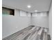 Finished basement featuring new flooring, recessed lights, and updated fixtures at 9208 N 27Th St, Tampa, FL 33612