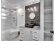 Stylish bathroom with unique vanity, black accents, and a glass-enclosed shower at 9208 N 27Th St, Tampa, FL 33612