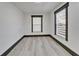 Bright bedroom featuring new flooring, recessed lights, and modern window treatments at 9208 N 27Th St, Tampa, FL 33612