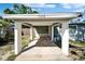 Front car port with a stone pathway leading to the front door of this house, marked with number 9208 at 9208 N 27Th St, Tampa, FL 33612