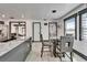Dining area featuring granite countertops, modern light fixtures, and space for entertaining at 9208 N 27Th St, Tampa, FL 33612