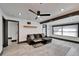 Contemporary living room featuring a gray sofa, light wood floors, and modern recessed lighting at 9208 N 27Th St, Tampa, FL 33612