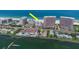 A captivating aerial shot highlighting the condo's prime location amidst stunning beachfront and bay views at 1350 Gulf Blvd # 301, Clearwater Beach, FL 33767