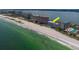 Breathtaking aerial view of oceanfront condos with turquoise waters and sandy beach, ideal for relaxation at 1350 Gulf Blvd # 301, Clearwater Beach, FL 33767