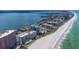 Stunning aerial view of beachfront condominiums with pristine white sand and turquoise waters at 1350 Gulf Blvd # 301, Clearwater Beach, FL 33767