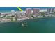 Sweeping aerial view showcasing the condo complex with beachfront access and stunning waterfront scenery at 1350 Gulf Blvd # 301, Clearwater Beach, FL 33767