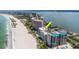 Beautiful aerial view of a beachfront condo with pools and beach access, perfect for luxury living at 1350 Gulf Blvd # 301, Clearwater Beach, FL 33767