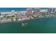Picturesque aerial view featuring condos, waterfront access, docks, and coastal living at its finest at 1350 Gulf Blvd # 301, Clearwater Beach, FL 33767