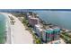Stunning aerial view showcases beachfront condo complex with private beach and panoramic ocean views at 1350 Gulf Blvd # 301, Clearwater Beach, FL 33767