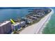 Picturesque aerial showcases beachfront condos along a pristine beach, offering a tranquil coastal lifestyle at 1350 Gulf Blvd # 301, Clearwater Beach, FL 33767