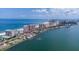 Expansive aerial view of beachfront condos in a coastal city offering stunning waterfront views at 1350 Gulf Blvd # 301, Clearwater Beach, FL 33767