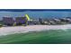 Gorgeous aerial of beachfront condos featuring pristine beach access and picturesque ocean views at 1350 Gulf Blvd # 301, Clearwater Beach, FL 33767