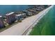 Magnificent aerial perspective showcases beachfront condos with stunning views of the ocean and coastline at 1350 Gulf Blvd # 301, Clearwater Beach, FL 33767