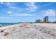 Wide sandy beach with views of beachfront condos, ideal for relaxation and ocean activities at 1350 Gulf Blvd # 301, Clearwater Beach, FL 33767
