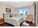 Charming bedroom with palm tree ocean views, a comfortable bed, and a cozy chair near a window at 1350 Gulf Blvd # 301, Clearwater Beach, FL 33767