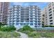 Stunning beachfront condo with multiple balconies offering panoramic ocean views and lush landscaping at 1350 Gulf Blvd # 301, Clearwater Beach, FL 33767