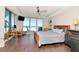 Main bedroom offers ocean views, dark wood floors and comfortable furnishings at 1350 Gulf Blvd # 301, Clearwater Beach, FL 33767
