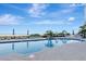 Inviting community pool with ocean views and plenty of lounge chairs at 1350 Gulf Blvd # 301, Clearwater Beach, FL 33767
