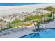 Aerial view of the pool and loungers next to a beach at 1350 Gulf Blvd # 301, Clearwater Beach, FL 33767