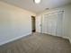 Carpeted bedroom with a closet at 10408 N 50Th St # 1/2, Tampa, FL 33617