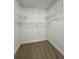Empty walk-in closet with shelving and carpeted floors at 10408 N 50Th St # 1/2, Tampa, FL 33617
