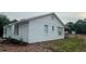 Home exterior boasting stone accents, wood shutters, and a covered porch, enhancing curb appeal and outdoor enjoyment at 10408 N 50Th St # 1/2, Tampa, FL 33617