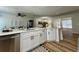 Modern kitchen with stainless steel appliances, white countertops, and an open view to living area at 10408 N 50Th St # 1/2, Tampa, FL 33617