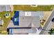 Aerial view of the home's roof, carport and surrounding gravel yard at 109 W Saint Lucia Loop, Apollo Beach, FL 33572