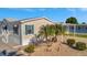Charming home featuring tropical landscaping and blue shutters at 109 W Saint Lucia Loop, Apollo Beach, FL 33572