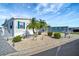 Charming home with tropical landscaping, blue shutters, and well-maintained lawn at 109 W Saint Lucia Loop, Apollo Beach, FL 33572