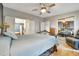 Tranquil bedroom featuring neutral walls, wood flooring, and a glimpse of an adjacent bathroom at 109 W Saint Lucia Loop, Apollo Beach, FL 33572