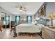 Comfortable bedroom includes a decorative metal bed frame, neutral walls, and ample closet space at 109 W Saint Lucia Loop, Apollo Beach, FL 33572