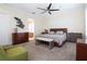 Bright bedroom with neutral carpet, ceiling fan, and decorative furnishings at 11105 5Th E St, Treasure Island, FL 33706