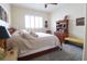 Cozy bedroom with neutral tones, carpeted floors, and a large window for natural light at 11105 5Th E St, Treasure Island, FL 33706