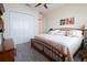Bedroom featuring a large bed with patterned pillows, and double closet doors at 11105 5Th E St, Treasure Island, FL 33706