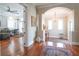 Inviting entryway with hardwood floors, archway to dining area, and view into adjacent sitting room at 11105 5Th E St, Treasure Island, FL 33706